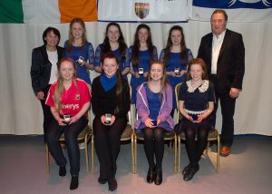 Pictured with Pauline Rooney and Seamus McElwain are the Drumhowan Irish Dancing team who came first in the Scór na nÓg. They are Aine Grogan, Sinead Grogan, Cait Brennan, Orlaith Brennan, Blinne Treanor, Christina Sherry, Lorna McGuirk and Angie McGuirk. © Northern Standard